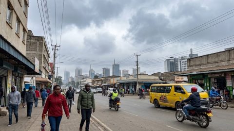 A cloudy afternoon along a busy Nairobi street as pedestrians dress warmly for the cool weather.